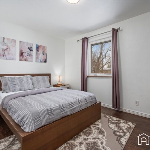 Enjoy a restful night's sleep in the upstairs bedroom, furnished with a queen bed and offering great natural light.