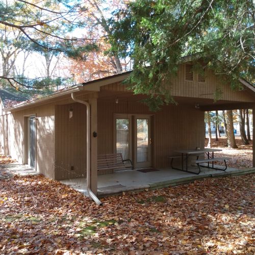 Exterior:  the back of the cabin, showing the private back porch and picnic table