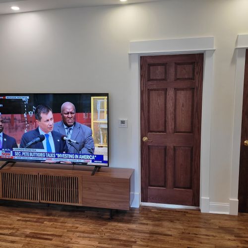 Living room #1 (main floor):  the home has a very stylish living room with a very large live-streaming television.
