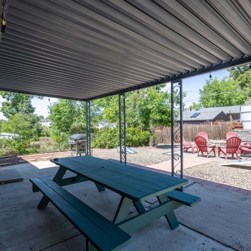 Alfresco meals feel magical in this breezy outdoor dining setup.