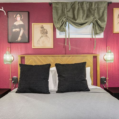 A close-up of the fourth bedroom reveals its playful eclectic design, showcasing vibrant patterns and unique decor details that add character and charm to this inviting space.