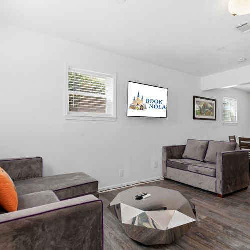 Sun-lit sitting area w/ large windows & comfortable seating to unwind.