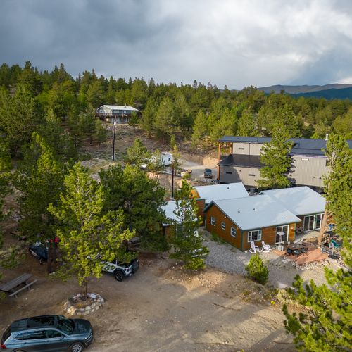 These rustic retreats sit cradled in nature's embrace.