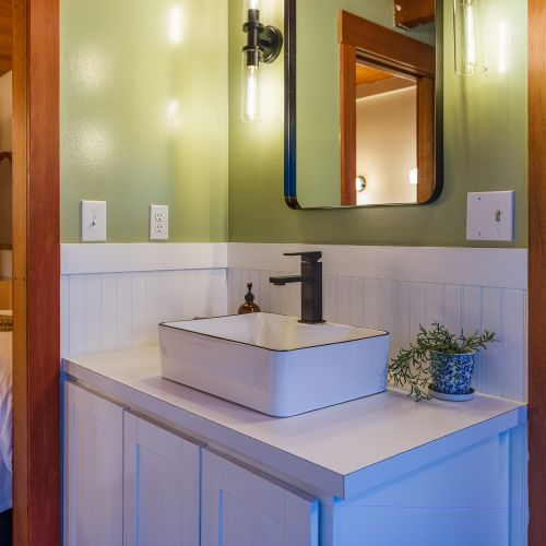 Bathroom on the main level opens to the guest bedroom.