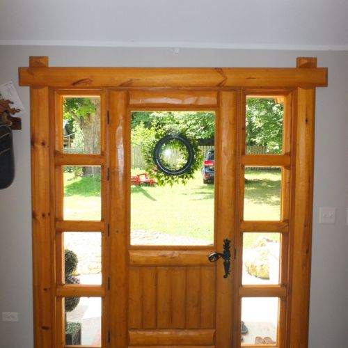 Living room:  guests enter into the living room via the beautifully ornate hand-made wooden entrance to the house.