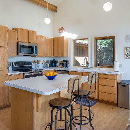 Outdoor dining is just outside the sliding glass doors of the kitchen and dining area.  The BBQ is just steps away.