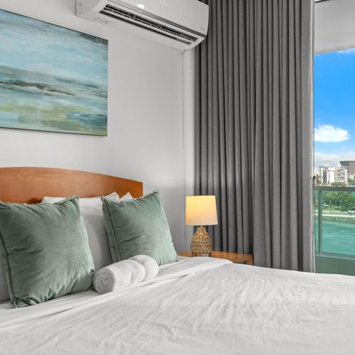 Enjoy resort-style living with a spacious bedroom area and private balcony overlooking the beautiful lagoon.