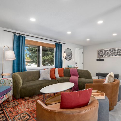 A lively main living room with eye-catching colors and trendy furnishings, creating an inviting space to unwind and enjoy.