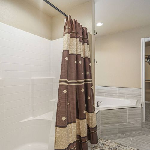 Step into a generous walk-in shower and take advantage of the ample closet space for easy storage