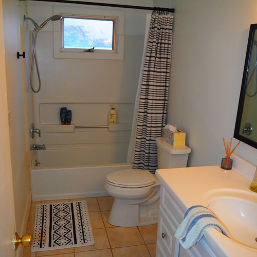 Bathroom #1:  full bathroom with a combination tub & shower.