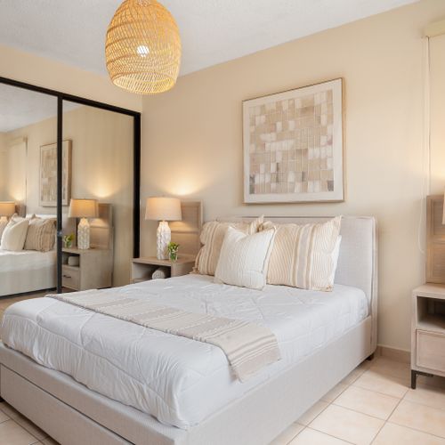 Step into comfort and style! This bedroom is a tranquil haven with a comfortable bed and practical amenities.