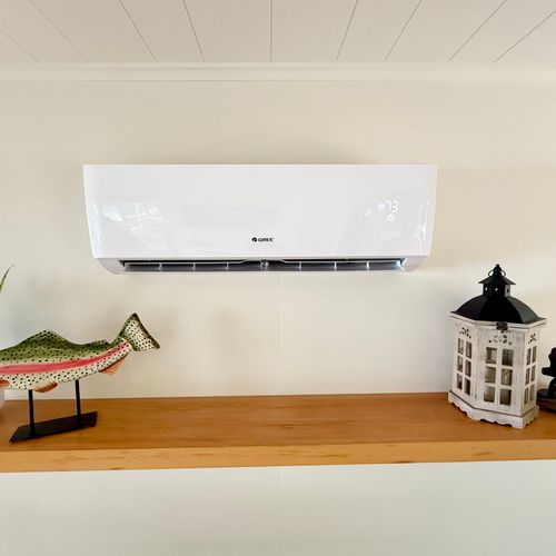 LIVING ROOM:  The living room features a mini-split dual heater and air conditioning unit to keep the cabin comfortable at all times.