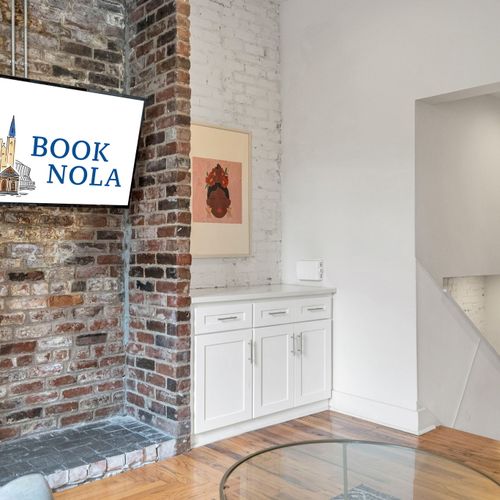 Historic charm meets modern comfort—exposed brick, curated art, and all the essentials for a memorable New Orleans stay.