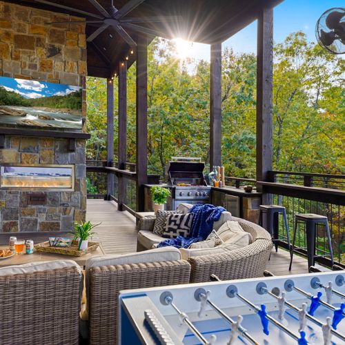 The magic of Glass and Timber truly unfolds when you step onto the expansive outdoor deck, where warm timber beams frame gorgeous views of the surrounding trees.