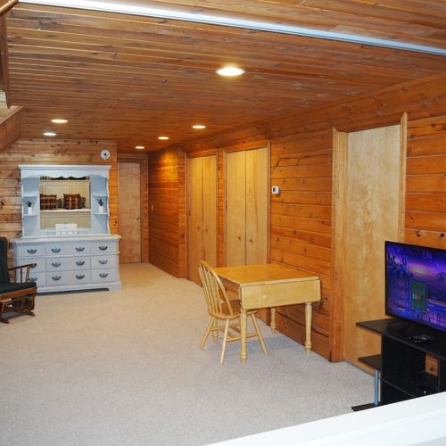 Bedroom #2 (second floor):  this is a huge upstairs bedroom with it's own television, desk, jetted tub, king-size bed, dresser, mirror, closet, and private en suite bathroom!