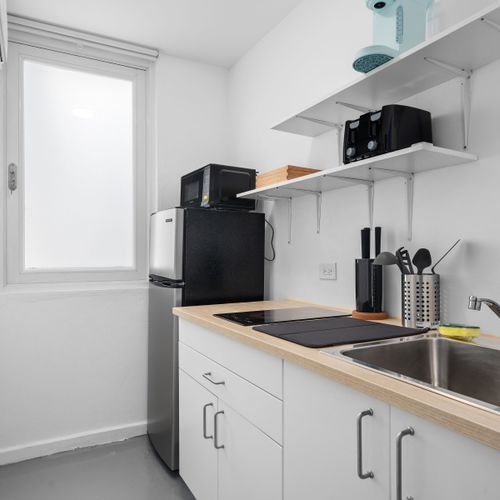 Cozy kitchenette with modern appliances.