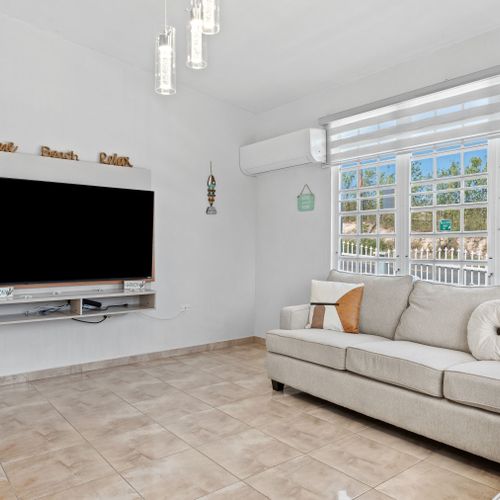 Relax in comfort! Spacious living room ideal for unwinding.