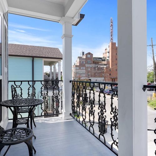Charming balcony overlooking the street — a perfect spot to soak in the surroundings.