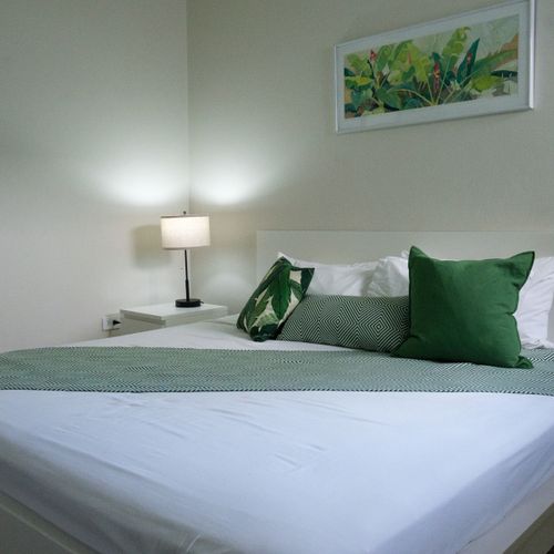 Experience peaceful nights in this bright and airy bedroom, where every detail contributes to a serene environment for your restful sleep.