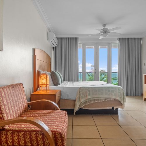 Wake up to paradise! Our inviting queen bed offers ultimate comfort, with direct balcony access and mesmerizing views of the Condado Lagoon