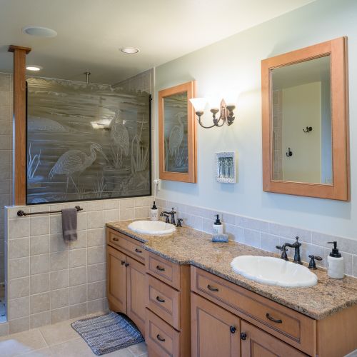 Master Bathroom with a double vanity and walk-in shower, jetted tub.