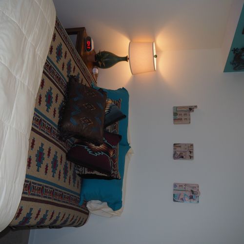 Bedroom:  very comfortable bedroom with a queen-size bed, ceiling fan, dresser, and mirror.
