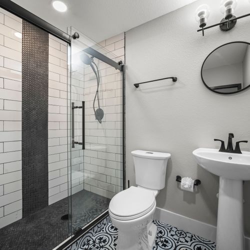 Clean, modern bathroom with spa-style walk-in shower.