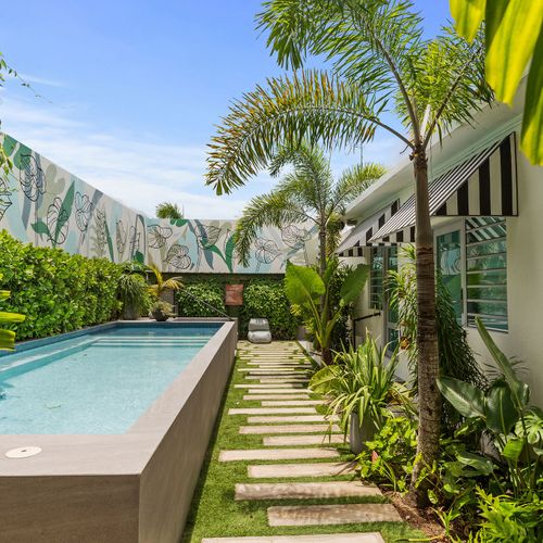 A tranquil garden path leads to your refreshing pool.