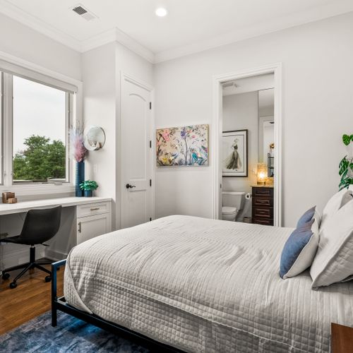 Bright and practical, the room includes a desk setup perfect for productivity.