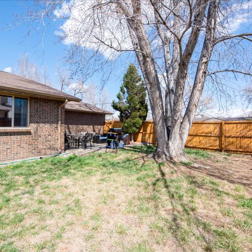 A secure and inviting fenced yard, perfect for outdoor activities with your family or furry companions.