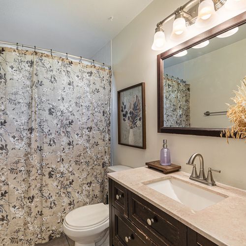 Walk-in shower offers easy access, sleek design, and a refreshing experience.