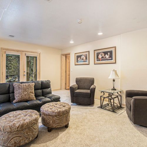Lounge with warm touches and natural light throughout.