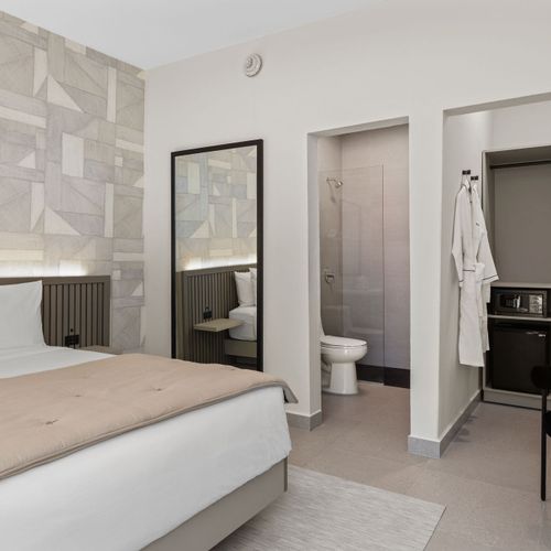 Comfortable bedroom with easy access to a modern bath.