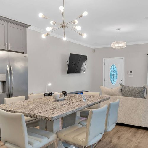 Open dining & kitchen area w/ modern finishes & plenty of seating.