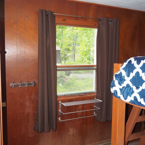 Bedroom #2:  features a full-on-full bunk bed, dresser, closet, and lamps.