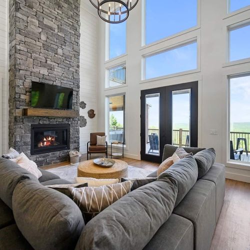 An oversized sectional around the floor to ceiling gas fireplace!