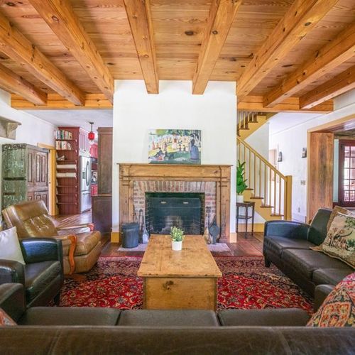 Main floor living area with fireplace and small library