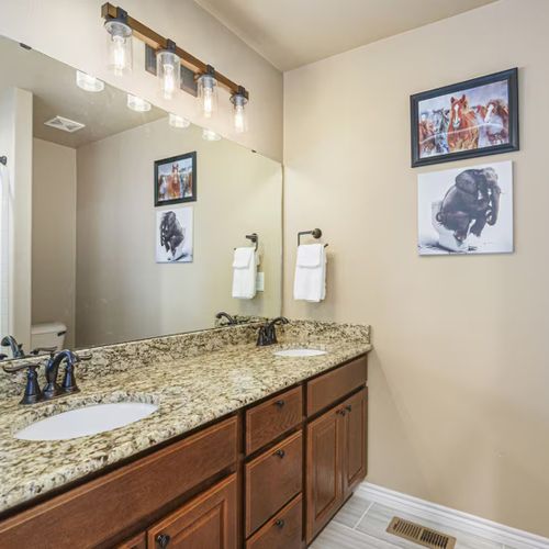 Bathroom with double vanities,  located in master bedroom.