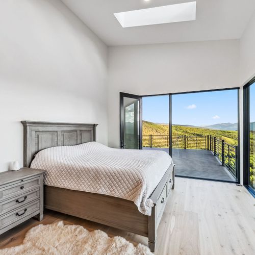 Rest easy in a king bed with soft light and views.