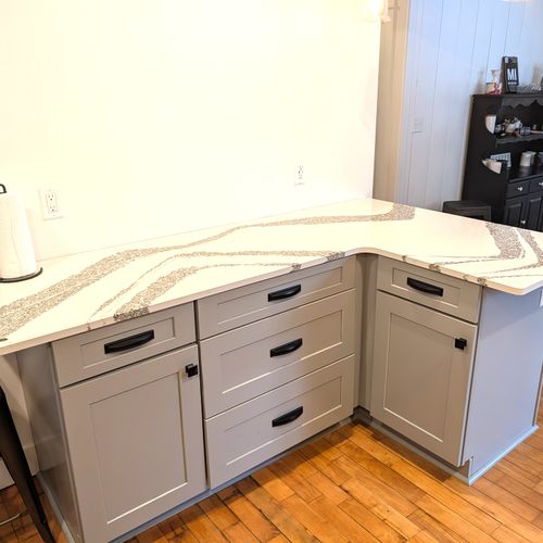 KITCHEN (MAIN FLOOR):  Fully-functional modern kitchen with newer appliances including a dishwasher and a gas range.