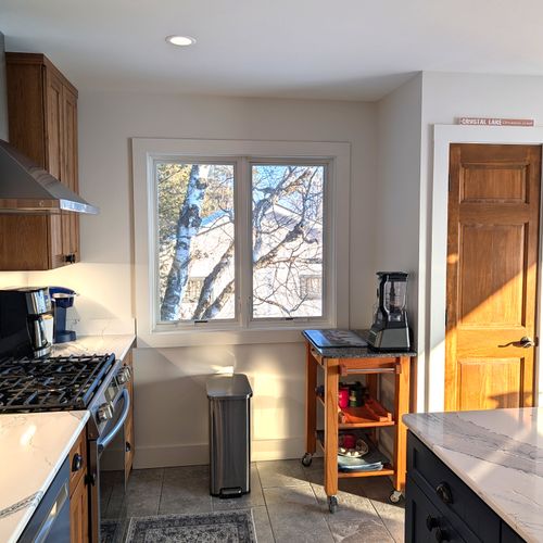 KITCHEN (MAIN FLOOR):  The home has a new and modern kitchen with all appliances including a dishwasher.  Also includes a coffee bar, kitchen island, and bar stools.