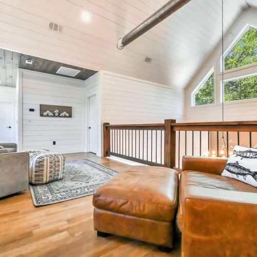 The upstairs lounge room where you can overlook the living area.