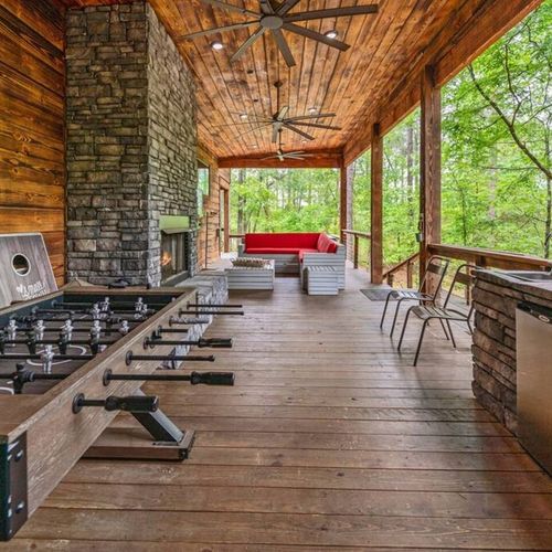 Foosball and cornhole provide entertainment on the outdoor patio.
