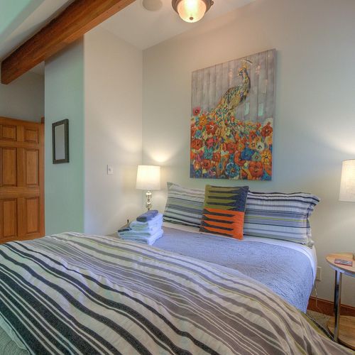 Guest bedroom with a comfy queen bed and quality linens.