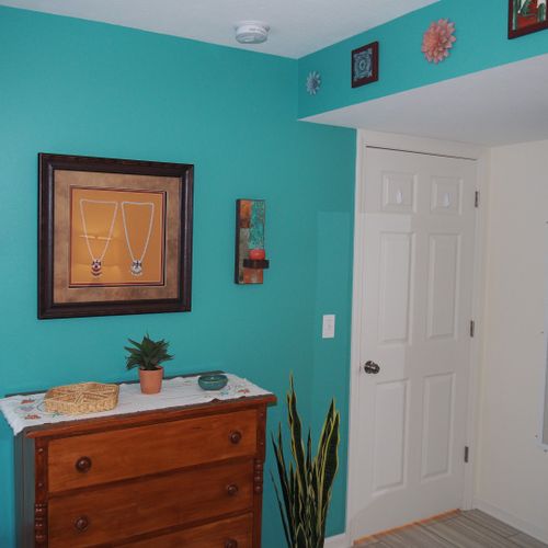Bedroom:  very comfortable bedroom with a queen-size bed, ceiling fan, dresser, and mirror.