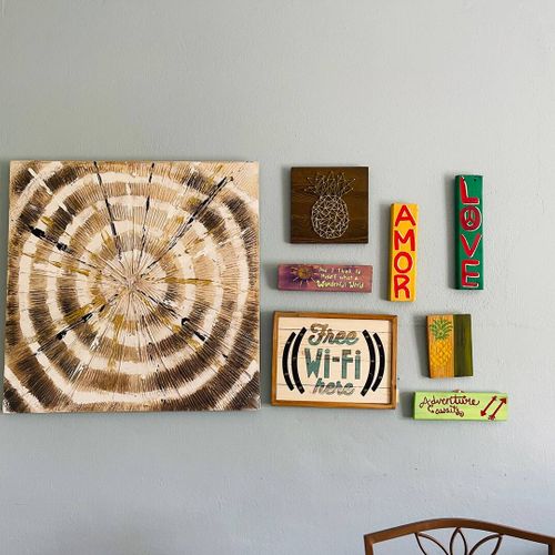 Connect and relax! Our beautifully curated space features unique local artwork and a clear Wi-Fi reminder, ensuring you stay connected while enjoying the charming decor.