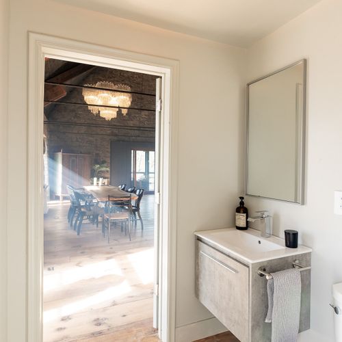 A view from the half bath into The Rifton's sunlit great room.