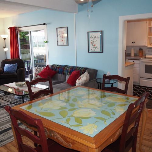 Dining area:  there is a hand-painted square dining table between the kitchen and living room with seating for 4 adults.