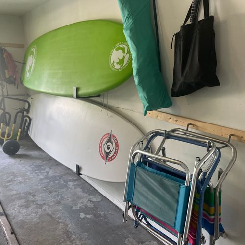 GARAGE:  The fun water and beach toys in the garage, which include paddleboards, beach chairs, and bicycles.