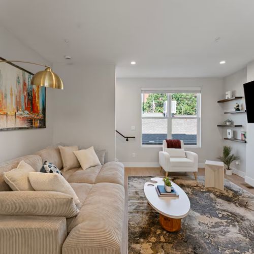 Experience the cloud-like comfort of the living room’s oversized couch.